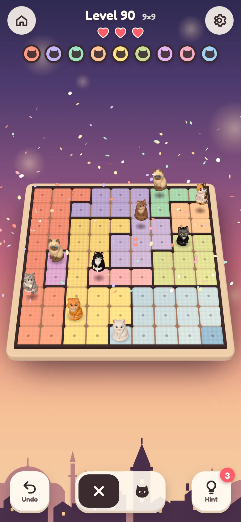 A solved 9×9 board: nine different cats in claimed gingham gardens, jumping under a shower of petals.
